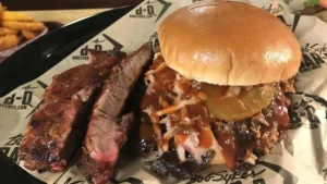 BBQ sandwich with ribs on a platter.